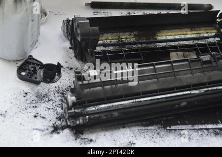 Charging the laser printer cartridge with toner the powder Stock Photo