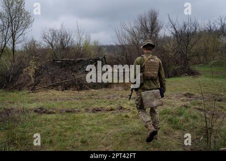 Bakhmut, Ukraine. 15th Apr, 2023. A Ukrainian soldier from the 17th tank brigade is seen walking towards a self-propelled howitzer at Ukrainian position near Bakhmut. Ukrainian armed force is fighting intensely in Bakhmut and the surrounding area as Russian forces are getting ever closer to taking the eastern city of Ukraine. The battle of Bakhmut is now known as “the bloodiest” and “one of the longest fight”, it has become one of the most significant fights in the war between Ukraine and Russia. (Photo by Ashley Chan/SOPA Images/Sipa USA) Credit: Sipa USA/Alamy Live News Stock Photo