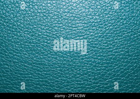 Blue colored leather surface background close up Stock Photo