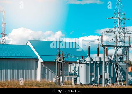 Three phase Big Electric Power high volt transformer in substation. Part of high-voltage substation with switches and disconnectors. Stock Photo
