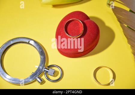 Wedding and engagement rings on the background of a the family holiday theme Stock Photo
