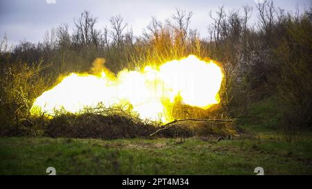 Ukrainian soldier from the 17th tank brigade is seen firing artillery rounds from a self-propelled howitzer at Ukrainian position near Bakhmut. Ukrainian armed force is fighting intensely in Bakhmut and the surrounding area as Russian forces are getting ever closer to taking the eastern city of Ukraine. The battle of Bakhmut is now known as “the bloodiest” and “one of the longest fight”, it has become one of the most significant fights in the war between Ukraine and Russia. Stock Photo