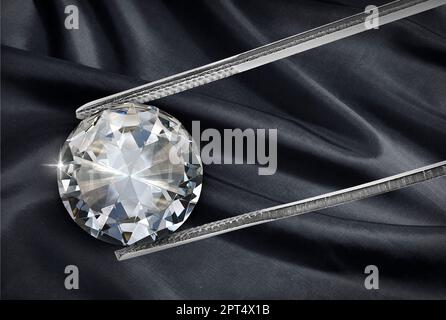 Shiny diamond on black fabric background held in diamond tweezers Stock Photo