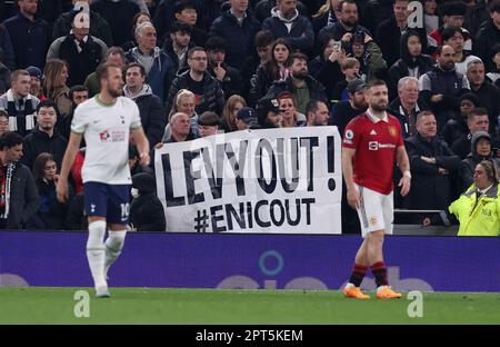 London, UK. 27th Apr, 2023. Tottenham fans hold up a sign saying “Levy Out ENIC Out” during the Premier League match at the Tottenham Hotspur Stadium, London. Picture credit should read: Paul Terry/Sportimage Credit: Sportimage Ltd/Alamy Live News