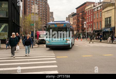 NYCTA bus turns onto West 14th Street from Eighth Avenue in Greenwich Village in New York on Thursday, April 6, 2023. (© Richard B. Levine) Stock Photo