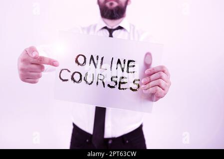 Writing displaying text Online Courses, Business idea earning an education that is conducted over the Internet Stock Photo
