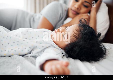Dreams flashing before her eyes. a mother watching her daughter sleep