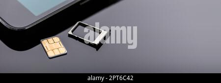 Sim Card Inserting In Smart Phone. Mobile Simcard Stock Photo