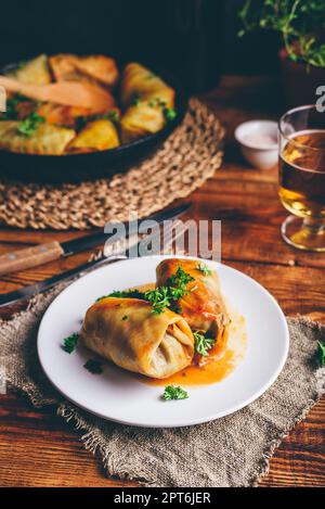 Stuffed Cabbage Rolls on White Plate Served with Chopped Parsley Stock Photo