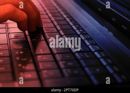 Hand on the keyboard with Russian layout. The concept of information protection, cyber attacks. The concept of work from home, business, online shoppi Stock Photo