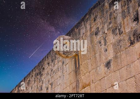 Detail of hoop ring at ball game court, Gran Juego de Pelota of Chichen Itza archaeological site in Yucatan, Mexico with Milky Way Galaxy stars night Stock Photo