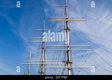 Sailing ship mast against the blue sky on some sailing boats with rigging details Stock Photo