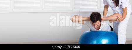 Physiotherapy Balance Exercise. Physiotherapist Ball Training Therapy Stock Photo