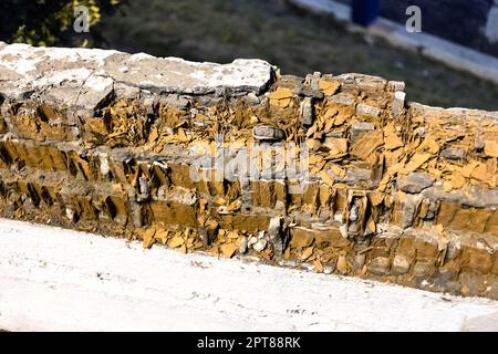 rotten brickwork under knocked down plaster in old town house Stock Photo
