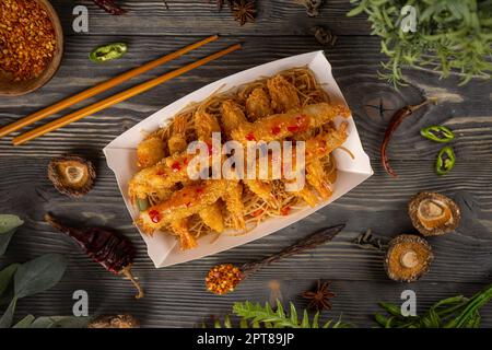 Shrimp tempura with sweet chili sauce served with noodles Stock Photo