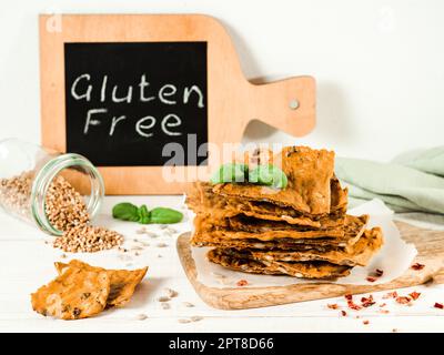 Gluten-freen crispbreads made from buskwheat flour. Green buckwheat flour, smoked paprika, sunflower seeds is ingredients for this homemade baked cris Stock Photo