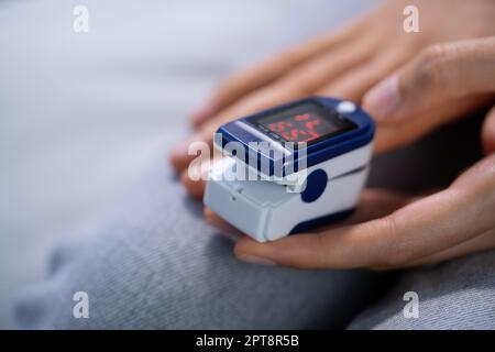 African Hand Pulse Heart Rate And Oximeter Stock Photo