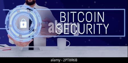 Hand writing sign Bitcoin Security, Business idea process to proactively monitor the brand reputation Man Holding A Tablet Projecting A Camera Showing Stock Photo