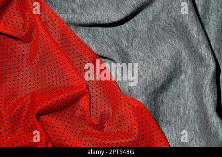Top view of cloth textile surface. Close-up rumpled heater and knitted fabric texture with a thin striped pattern. Sport clothing fabric texture. Colo Stock Photo