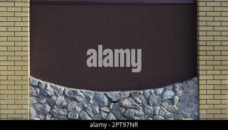 The texture of the concrete wall of the modern high-quality stone brick. Smooth texture brick wall with stone foundations handmade in bright sunlight Stock Photo