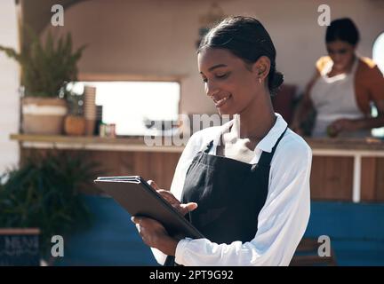 Ive worked hard to achieve my goals. a businesswoman using her digital tablet at work Stock Photo