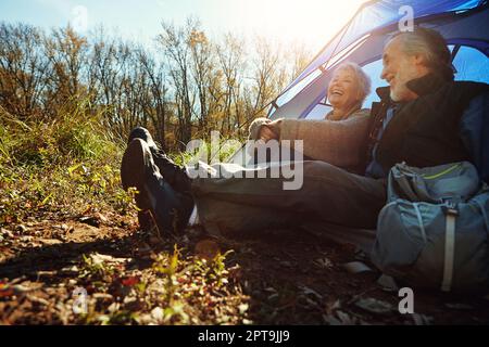 Theyre two happy campers. a senior couple camping together in the wilderness. Stock Photo