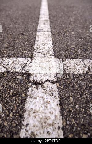 Marking lines on the asphalt, information sign Stock Photo