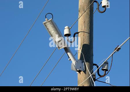 The LED street light is attached to a wooden pole. High quality photo Stock Photo