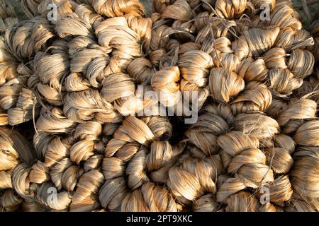 thick brown bundle of raw jute fiber Texture Background Stock Photo