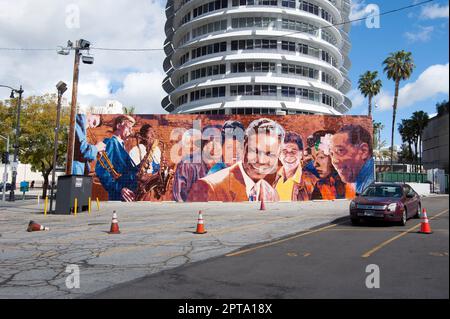 The Capitol Records building with a mural of Jazz greats including Nat King Cole, Miles Davis and others in Hollywood, CA Stock Photo