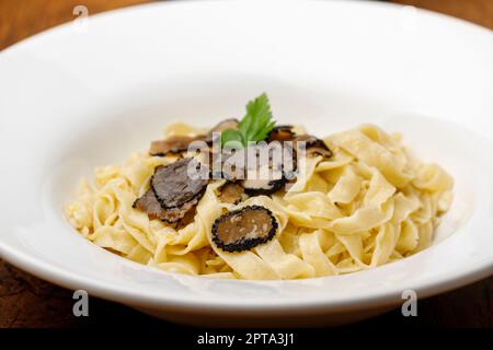 black truffle on home made pasta Stock Photo