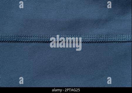Synthetic blue material with stitches line macro close up view Stock Photo