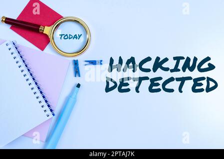 Writing displaying text Hacking Detected, Internet Concept activities that seek to compromise affairs are exposed Stock Photo