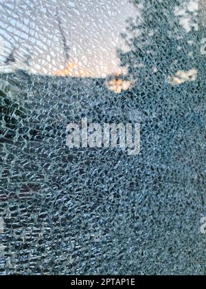 Broken glass with many shards after a burglary in close-up Stock Photo