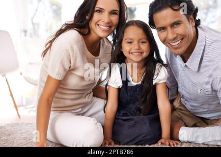 Family over everything. Cropped portrait of an affectionate young family at home Stock Photo