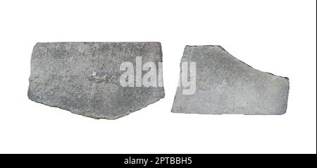 front view closeup of empty antique large square plaques of stone with irregular edges and carved texture isolated on white background Stock Photo