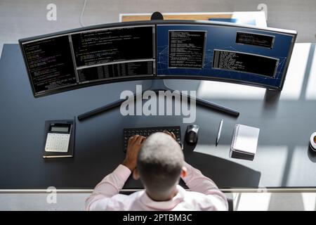 African American Man Programmer. Coding On Computer Stock Photo