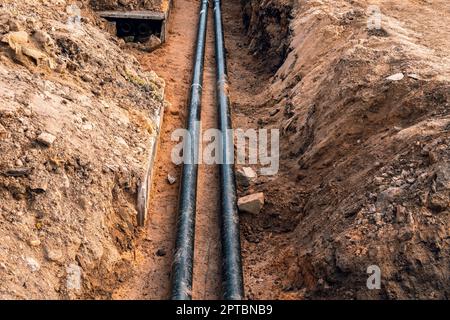 Replacement of underground district heating pipes on city street Stock Photo