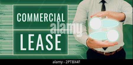 Text sign showing Commercial Lease, Conceptual photo study of both computer hardware and software design Man With Graphic S In Hands Presenting Exchan Stock Photo