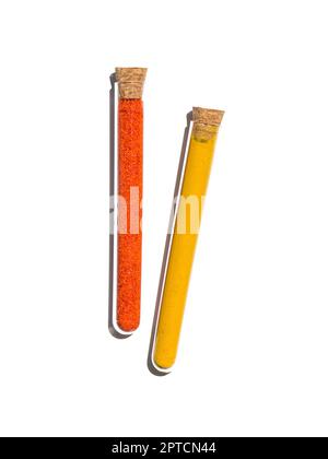 Potassium Ferricyanide and Organic Curcuma Powder in test tube with cork cap. Cosmetic chemicals ingredient on laboratory table. Top View Stock Photo