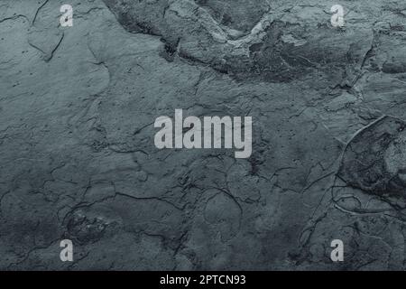 Worn gloomy grunge surface background with scratched rough texture. Stock Photo