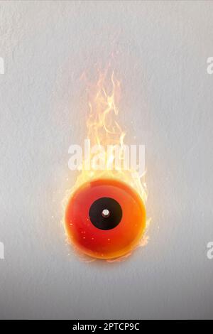 Fire by short circuit with manual fire alarm safety system Stock Photo