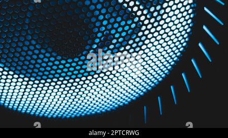 Detail of computer fan with blue color light abstract background. cooler grid close up. rgb led illumination Stock Photo