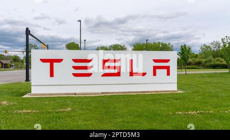 Closeup of Tesla ground sign is shown. Stock Photo