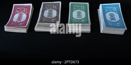 Stack of fake banknotes on black background. Stock Photo