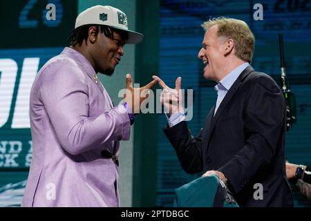 Georgia defensive lineman Jalen Carter, left, stands with NFL Commissioner  Roger Goodell after being chosen by the Philadelphia Eagles with the ninth overall  pick during the first round of the NFL football