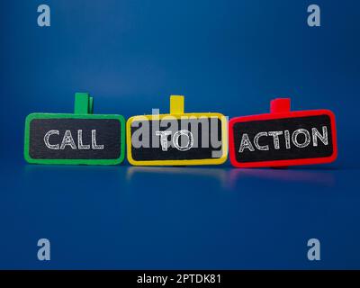 Colored wooden board with the word CALL TO ACTION on blue background Stock Photo