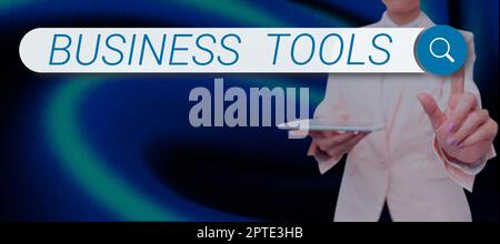 Sign displaying Business Tools, Business overview Protect the stored information safe Controlled technology Businessman in suit holding tablet symboli Stock Photo