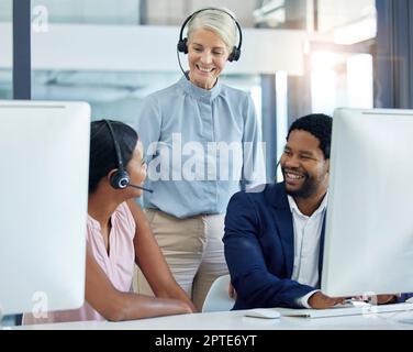 Call center, team and mentor in office for training, coaching and support with coach and staff in sales, telemarketing and customer support. Diversity Stock Photo