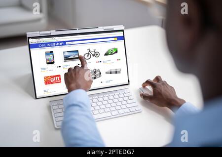 Online Ecommerce Shopping On Convertible Laptop Or Tablet Stock Photo